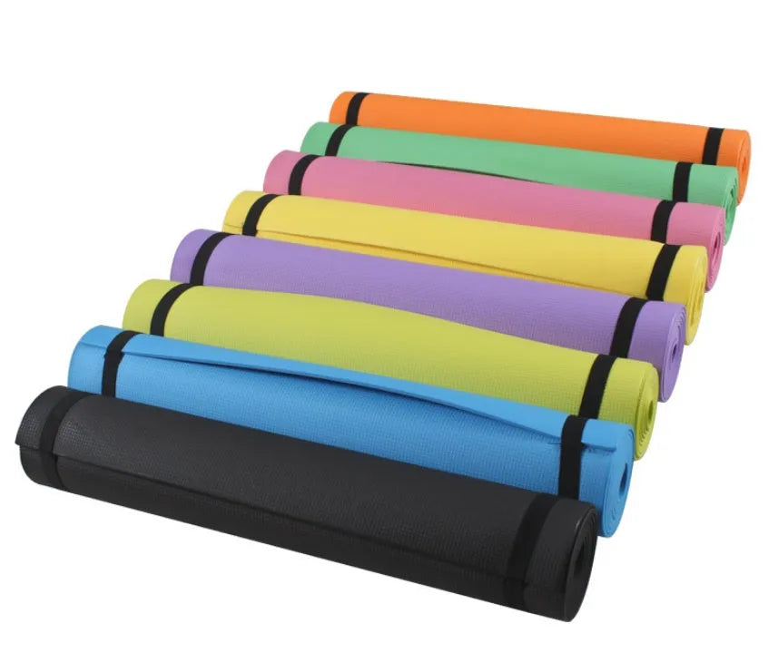 EVA foam yoga mat in blue, showing textured anti-slip surface, with a black OPP storage bag beside it.