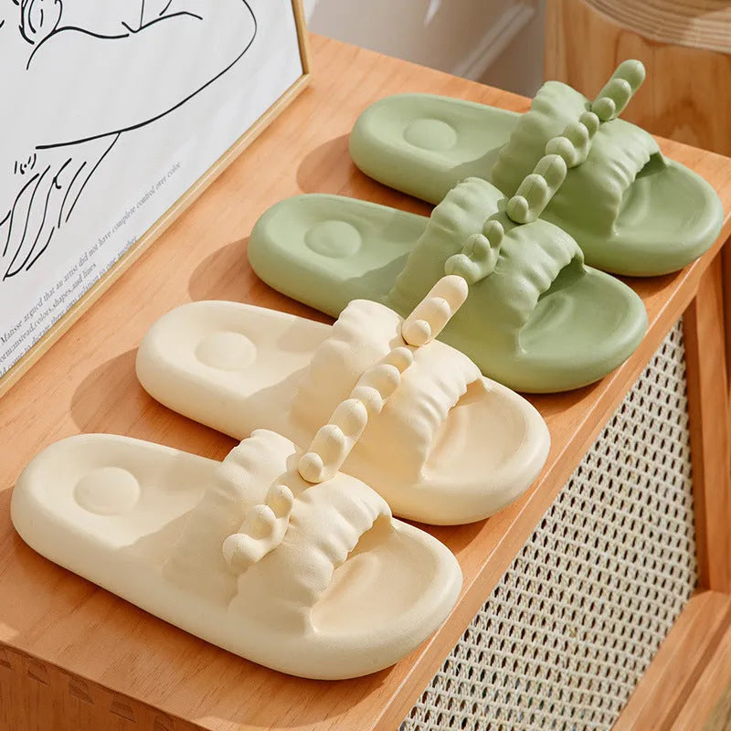 White deer horn pattern EVA flip-flop slippers with hollow-out design on a bathroom floor