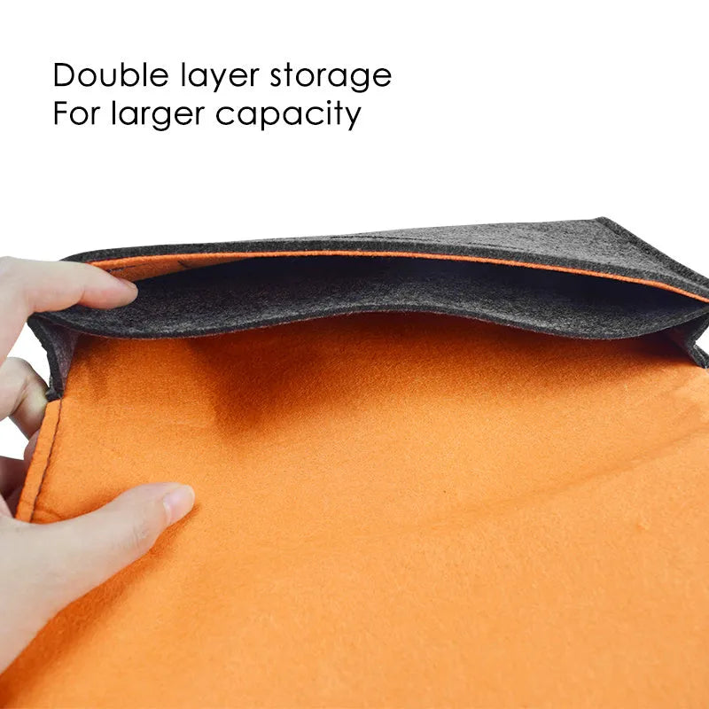 Black Nintendo Switch soft felt carrying pouch case showing game cartridge slots and double storage layers.