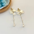 Women's acrylic shell pearl tassel earrings showing 8.8cm length and clip attachment options