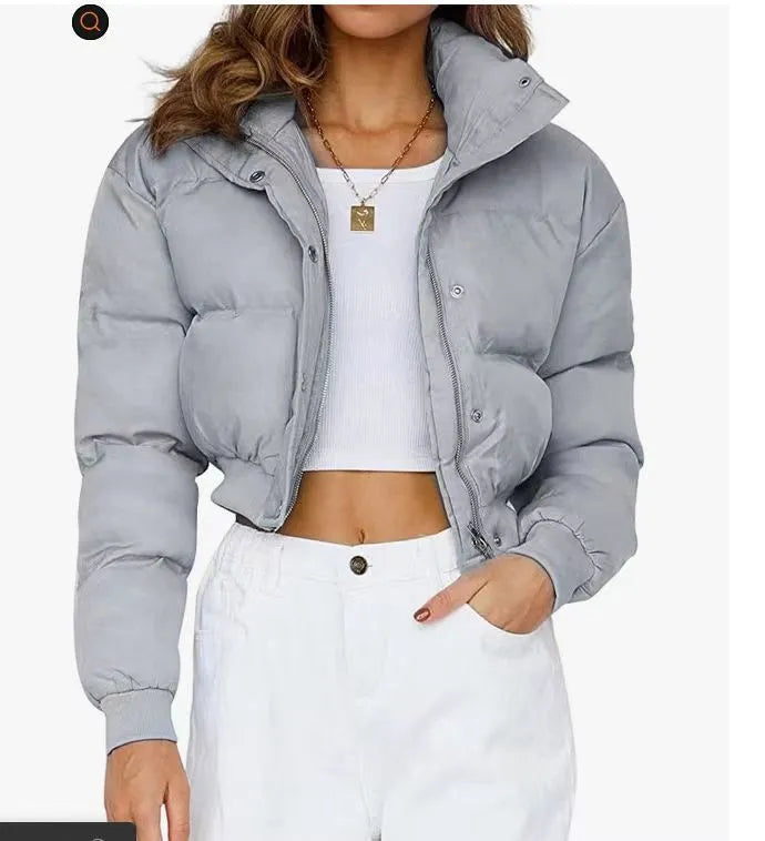 Women's loose blue polyester casual jacket with long sleeves on a hanger