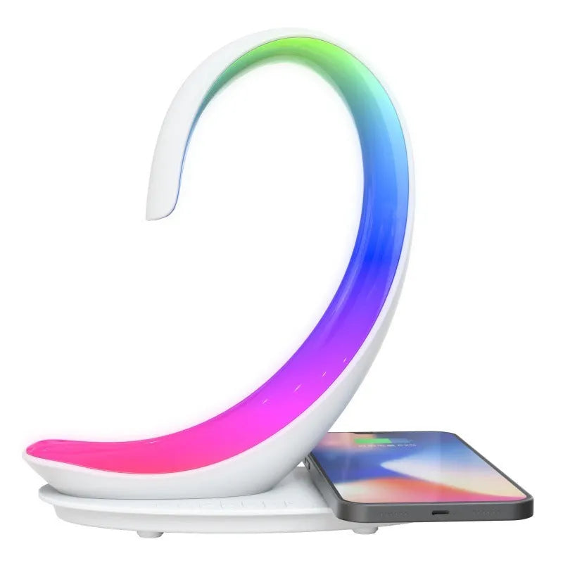 White swan-shaped desktop wireless charger with Bluetooth speaker and colourful ambient lighting
