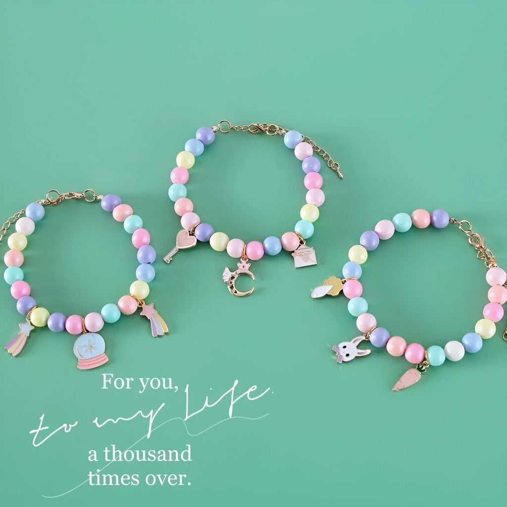 Colourful macaron-themed resin collar and bracelet set for pets on a pastel background.