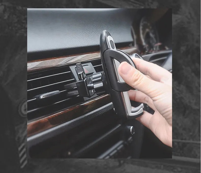 Black car mobile phone holder mounted on air conditioning vent with adjustable clamp for smartphones