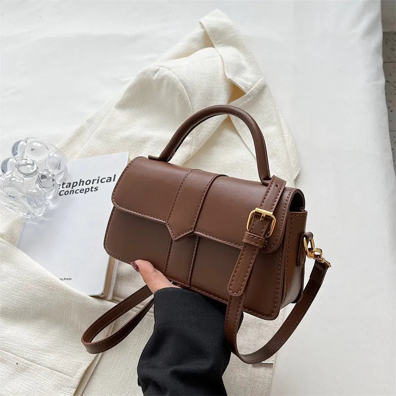 Women's beige PU leather messenger bag with horizontal file organiser and sandwich pocket