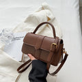 Women's beige PU leather messenger bag with horizontal file organiser and sandwich pocket