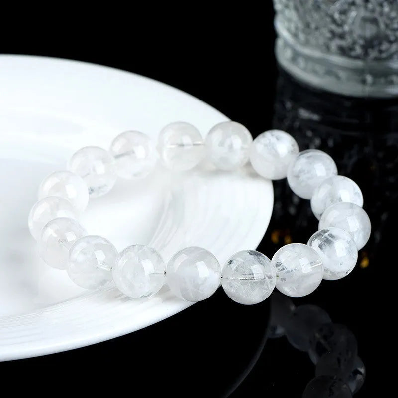 Women's crystal bracelet with natural blizzard snowflake round beads and traditional charm elements