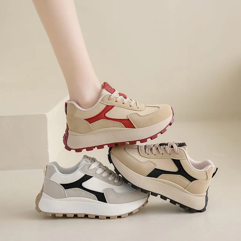 Women's solid colour platform sports shoes with lace-up front and flat rubber sole.