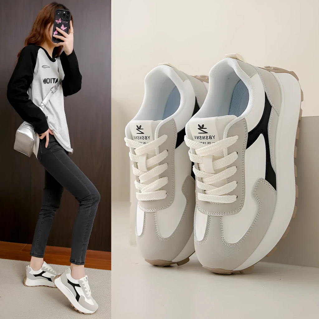 Women's solid colour platform sports shoes with lace-up front and flat rubber sole.