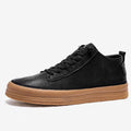 Men's black casual leather shoes with round toe, flat heel, and lace closure on a white background