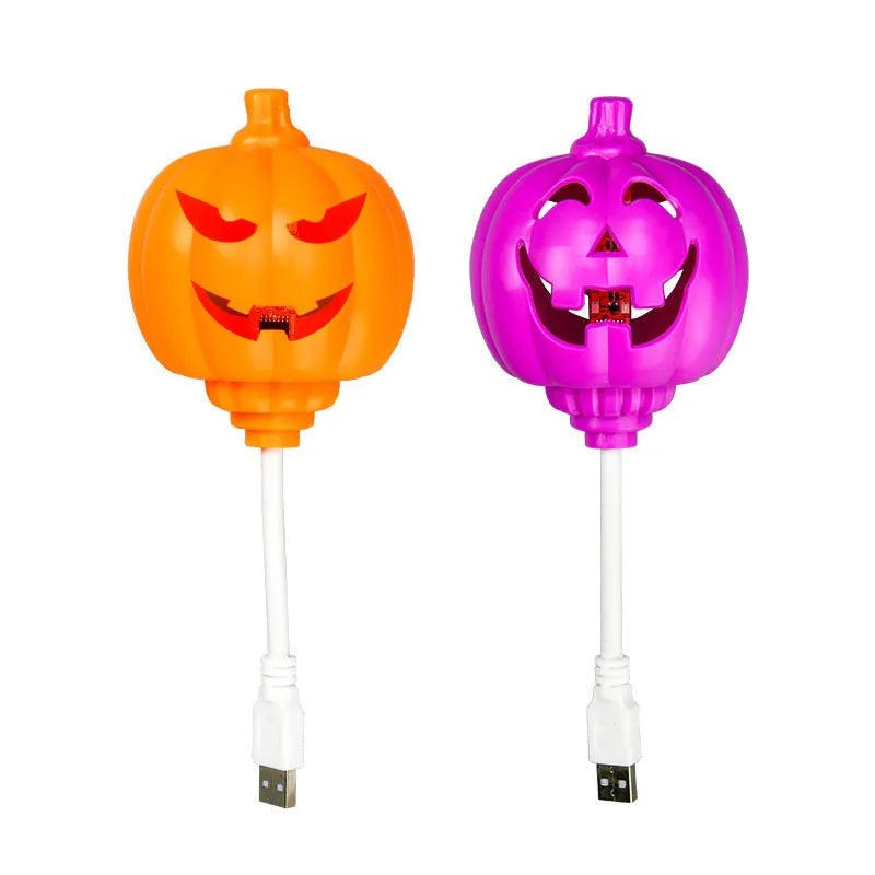Plastic pumpkin lamp with USB charging port displaying yellow or purple light option