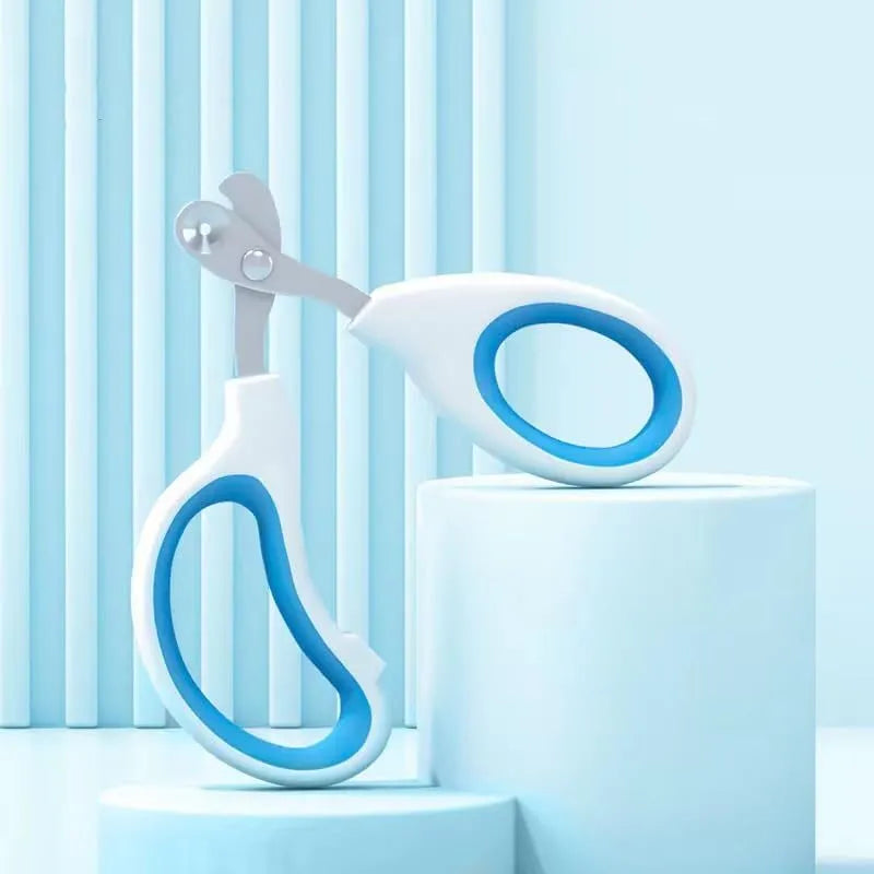 Blue cat nail clippers with circular cutting hole and cushioned non-slip handles on a white background.
