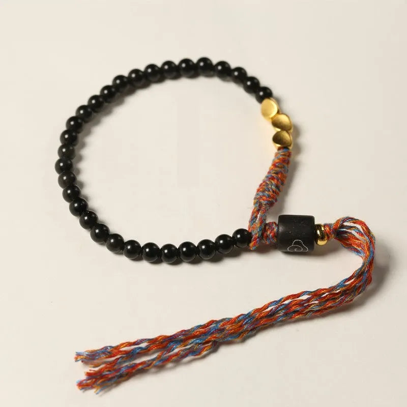 Hand-woven obsidian carrying strap showing 4mm width and adjustable length for phones, keys, or cameras