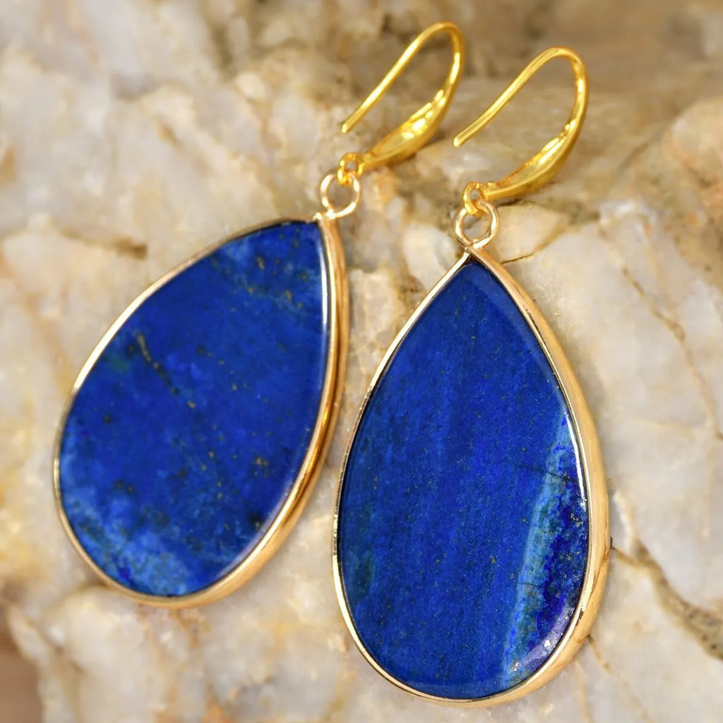 Women's silver-toned drop pendant earrings with a green aventurine stone, showing retro design and electroplated setting.