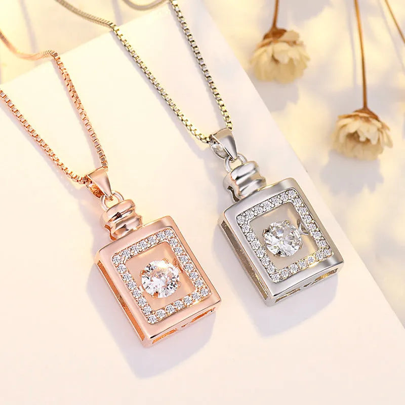 Sterling silver heart pendant necklace with crown and bow detailing in rose gold finish