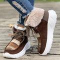 Women's beige lace-up snow boots with suede upper and thick rubber sole on white background