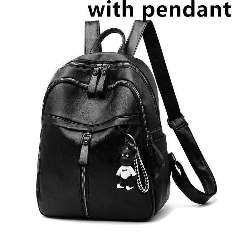 Black PU leather student backpack with double straps showing medium size and zipper opening
