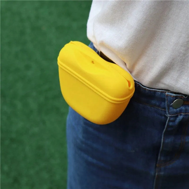 Silicone dog training treat pouch with belt clip and magnetic closure, shown in assorted colours.