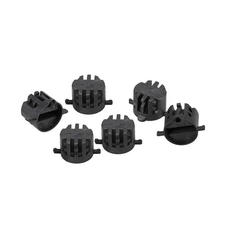 Set of six PVC surfboard G5 tail rudders in round cup design, black colour, on a flat surface