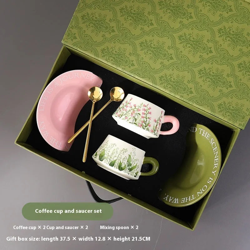 Ceramic coffee cup and saucer set for two people in Campanula design, with two mugs, two saucers, and two spoons.