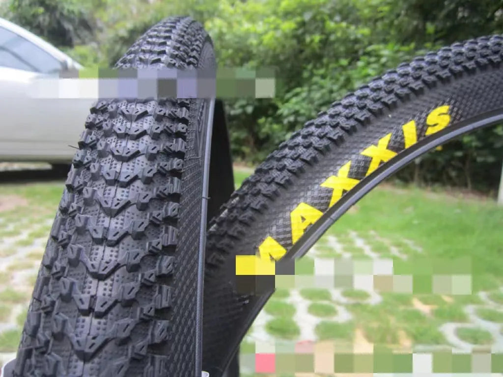 Ultralight puncture-resistant mountain bike tyre showing tread pattern, available in multiple wheel sizes.