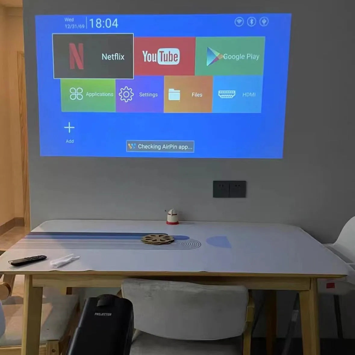 Home projector with wireless capability and screen handle for gaming and entertainment projection