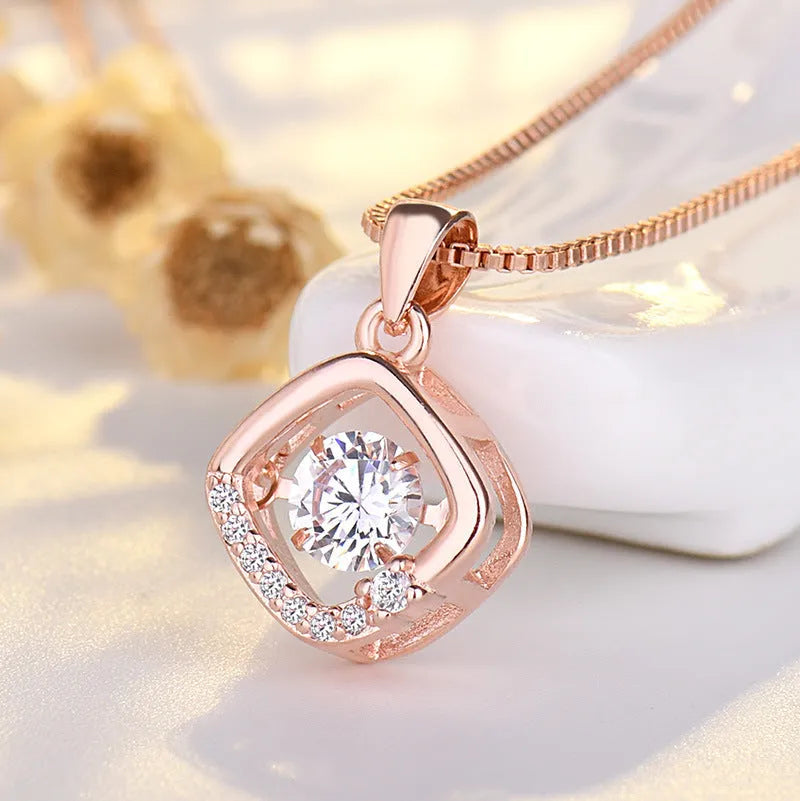 Sterling silver heart pendant necklace with crown and bow detailing in rose gold finish