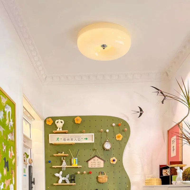 Cream coloured American style bedroom ceiling lamp with a modern vintage design shown in a bedroom setting.