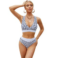 Women's leopard print V-neck bikini swimsuit with cross banded design and floral pattern briefs