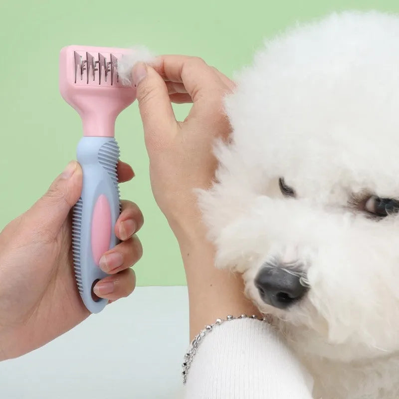 Pink and purple pet grooming comb with stainless steel knot knife and massage brush tips, shown with dimensions.