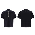 Black men's loose fit polo t-shirt with short sleeves and a square collar decorated with heavy embroidery sequins.