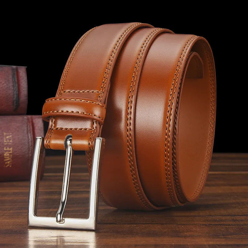 Men's classic black leather belt with a silver alloy pin buckle on a white background