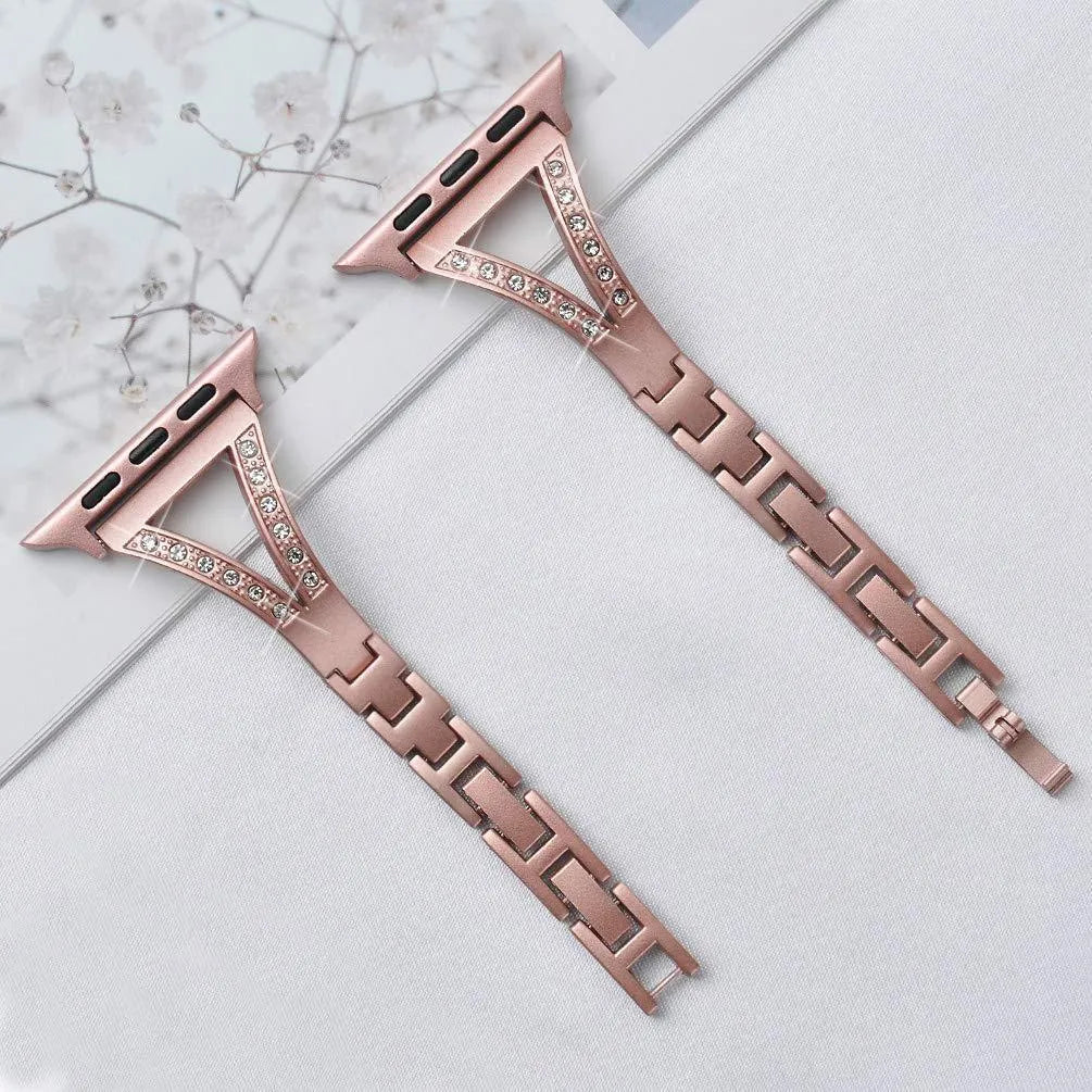 Silver herringbone diamond pattern metal band for Apple Watch on a wrist, showing adjustable links.