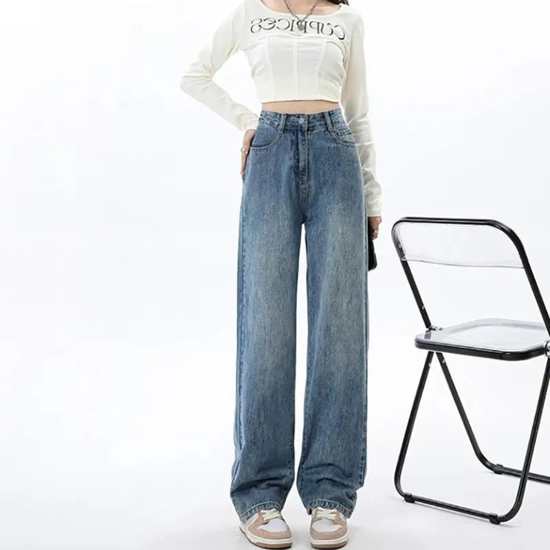 Women's retro blue wide leg jeans with high waist and straight leg silhouette on hanger