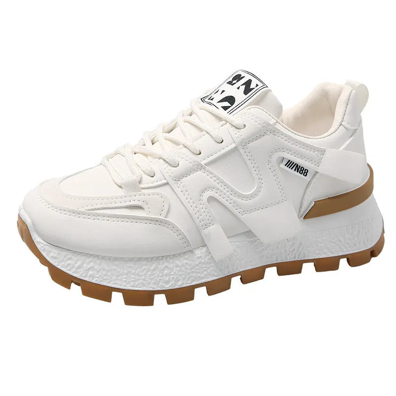 Women's low-top running sneakers in black with round toe and rubber sole, lace-up closure