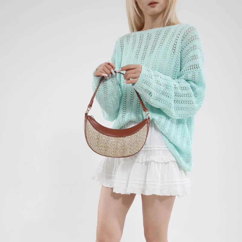 Hard straw dumpling-shaped crossbody bag with single strap and sandwich pocket in black, brown, green or white colour options
