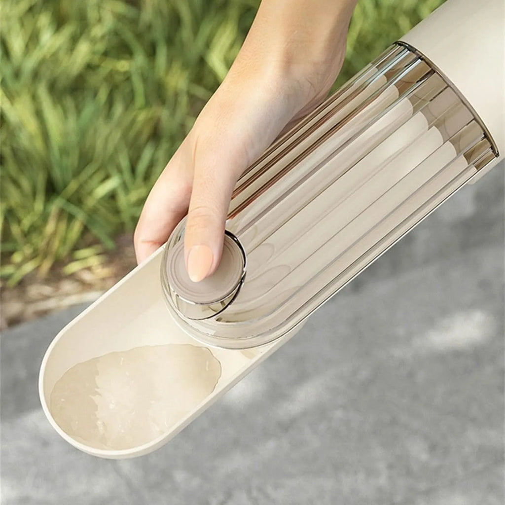 Beige or green foldable dog water bottle with food container, showing large drinking opening and compact size.