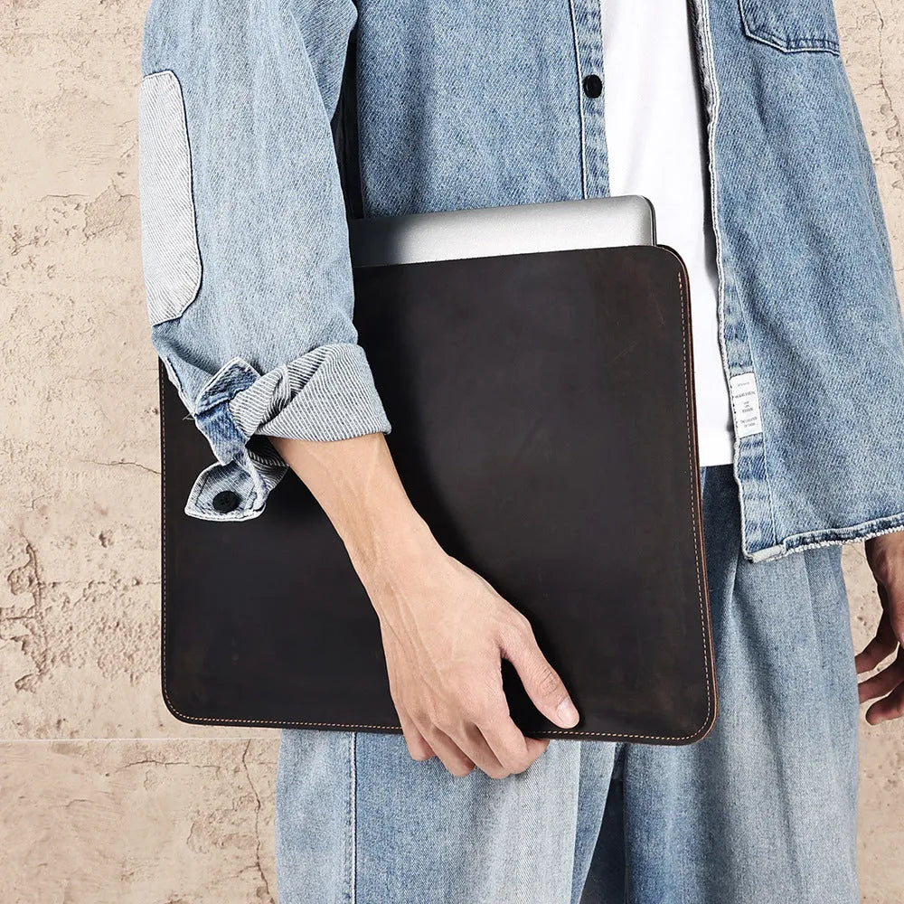 Brown genuine leather computer bag with horizontal liner design for organised storage