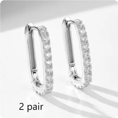 Close-up of a women's sterling silver earring featuring an oval-cut zircon stone.