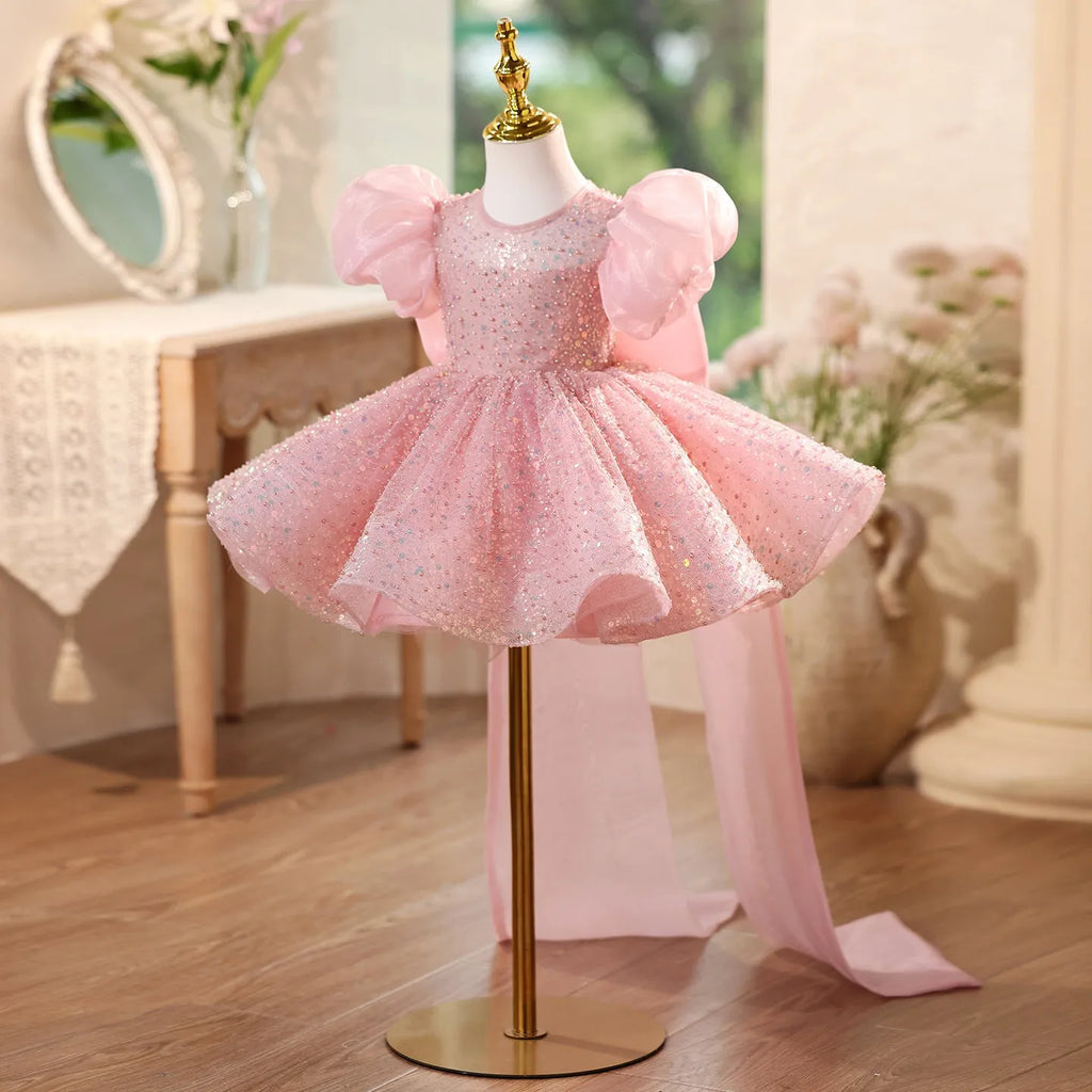 Children's sequined formal dress in pink with puff sleeves and princess-style silhouette for weddings and parties