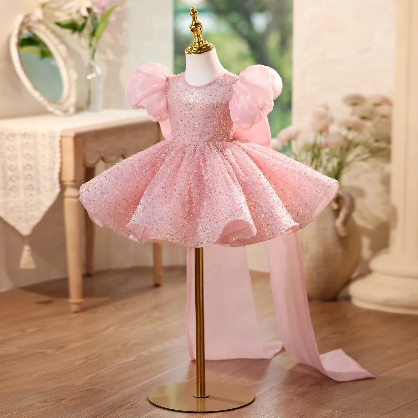 Children's sequined formal dress in pink with puff sleeves and princess-style silhouette for weddings and parties