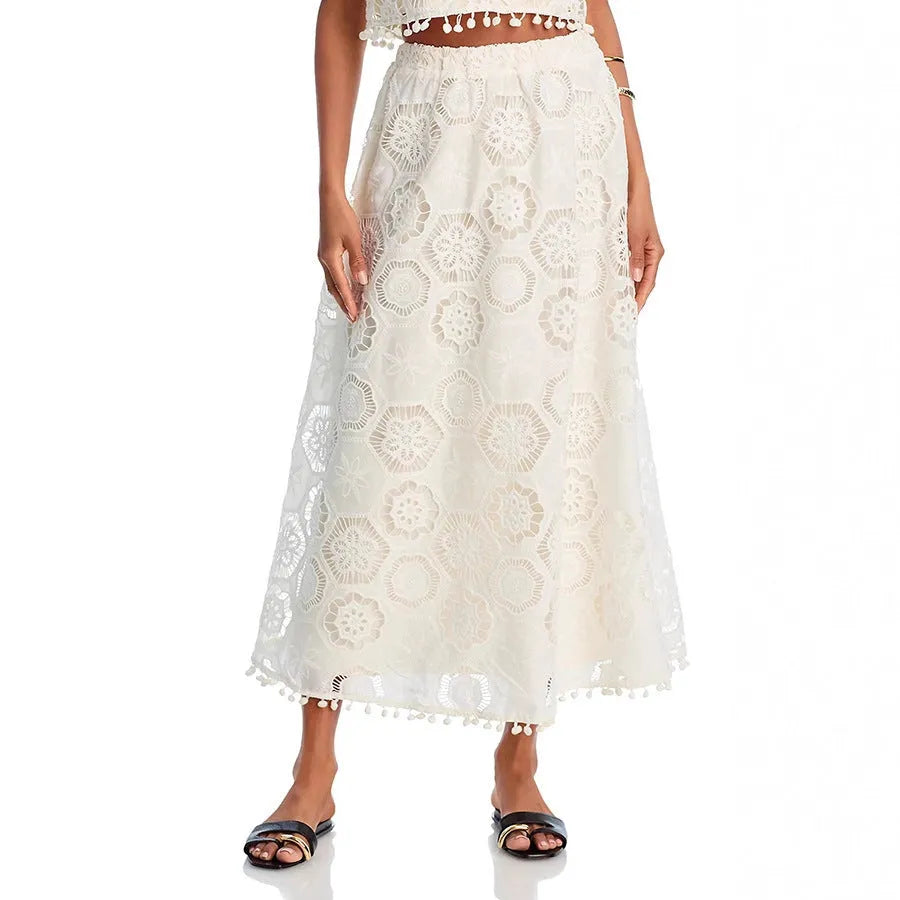 White women's retro style suit with sleeveless top, long skirt and embroidery detailing