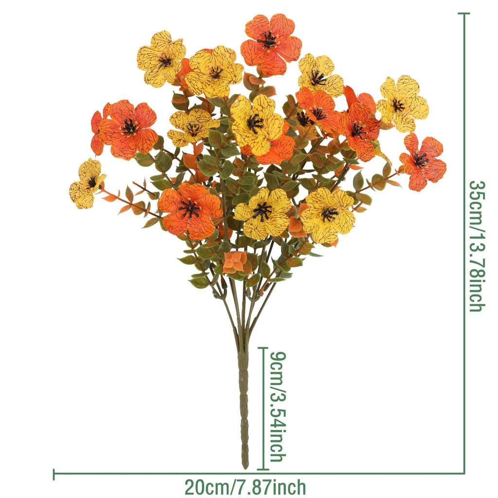 Artificial flower bouquet in autumn orange, yellow, and red colours with detailed plastic and silk construction