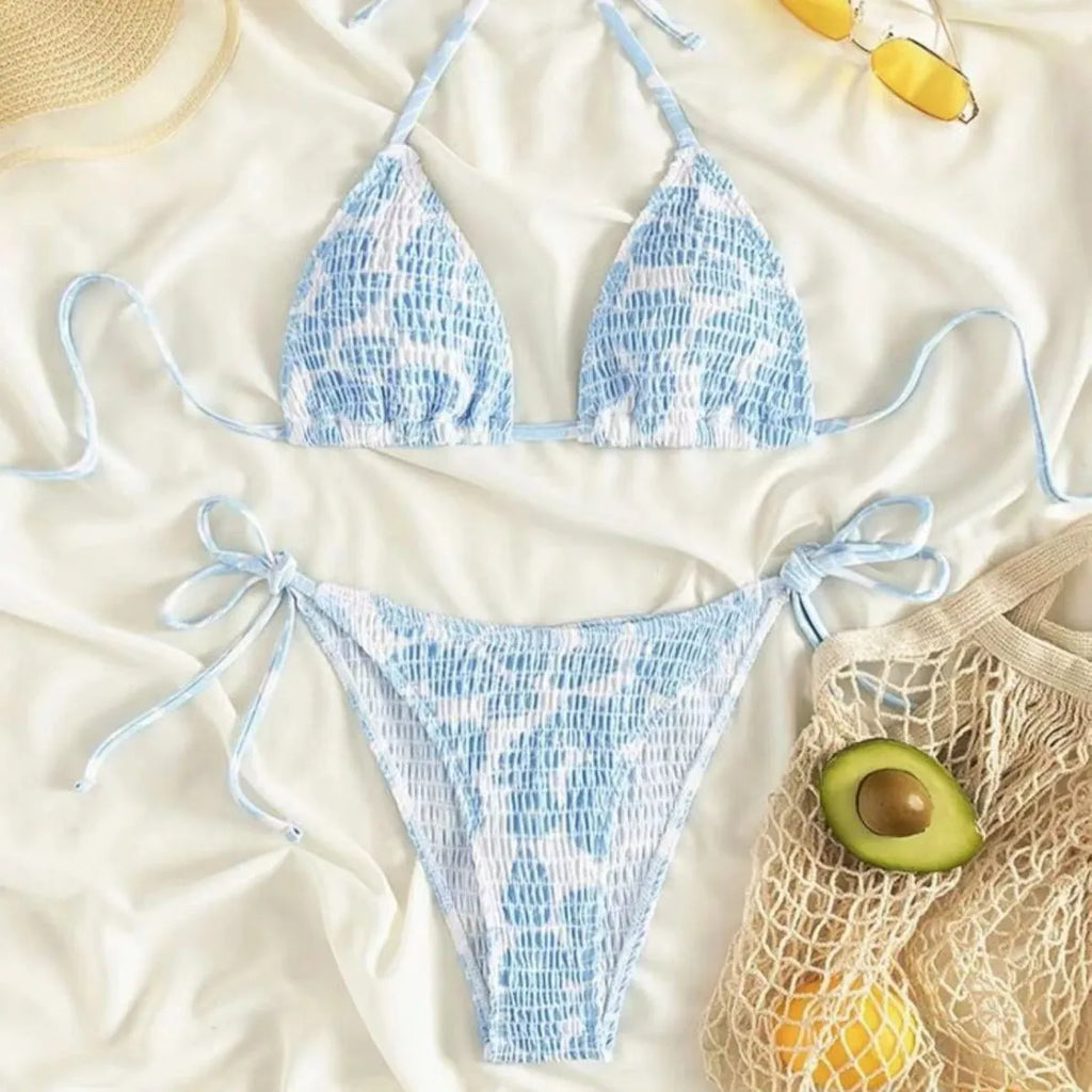 Women's floral pattern halter swimsuit briefs in light blue on a mannequin