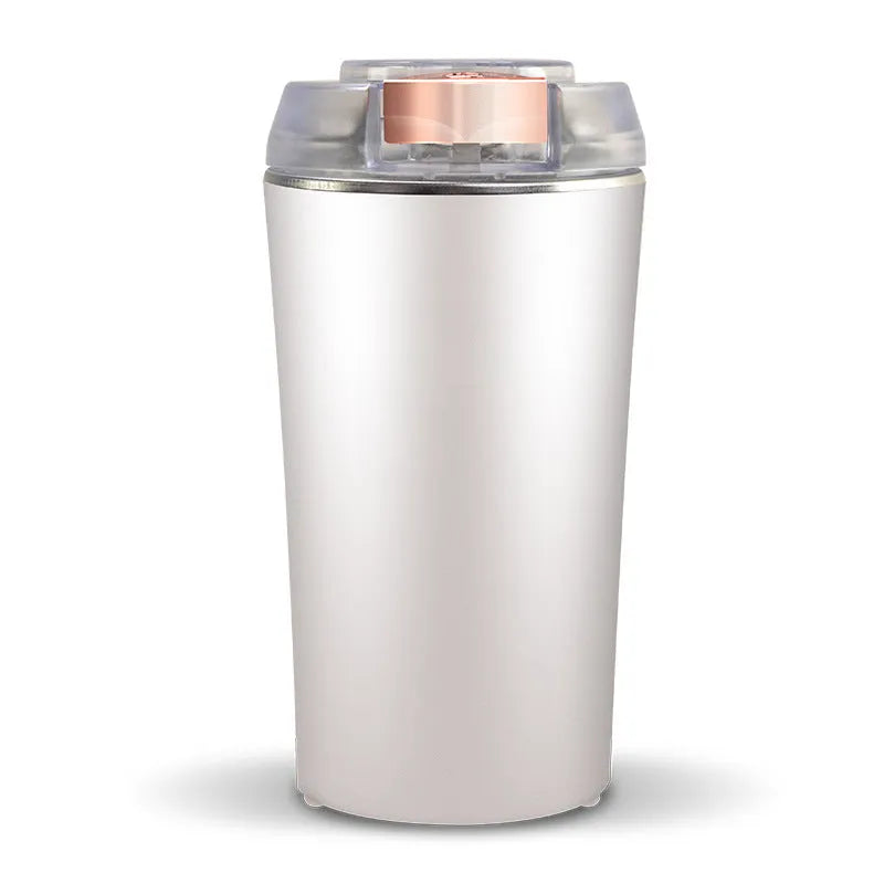 Blue mini flour mill and grinder machine for food on a kitchen worktop.