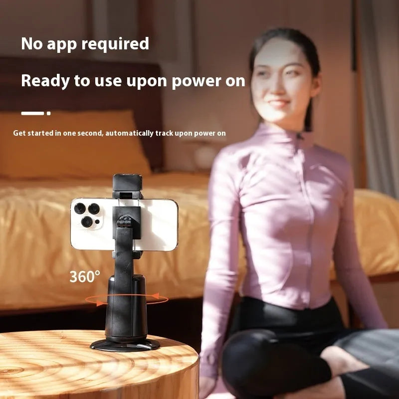Black intelligent desktop bracket with auto-rotating camera head and RGB ribbon lights.