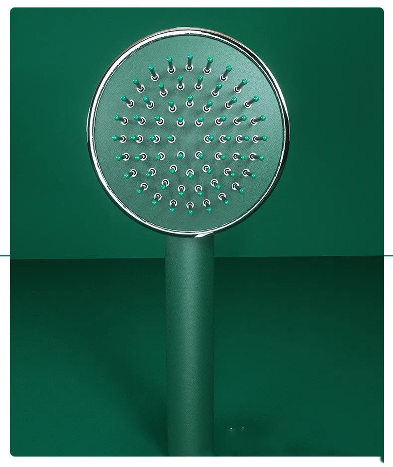 Plastic air cushion comb with long handle in white, green, and pink colours for hair detangling and styling