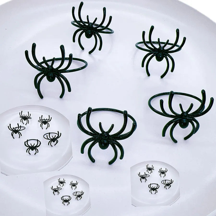 Set of six black alloy spider napkin rings with electrophoresis finish for Halloween table decoration