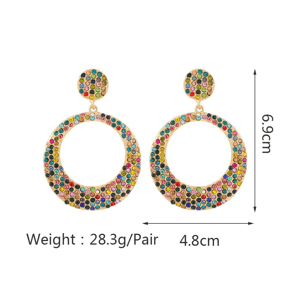 A pair of large round colour alloy pendant earrings with a cartoon style and diamond details for women.