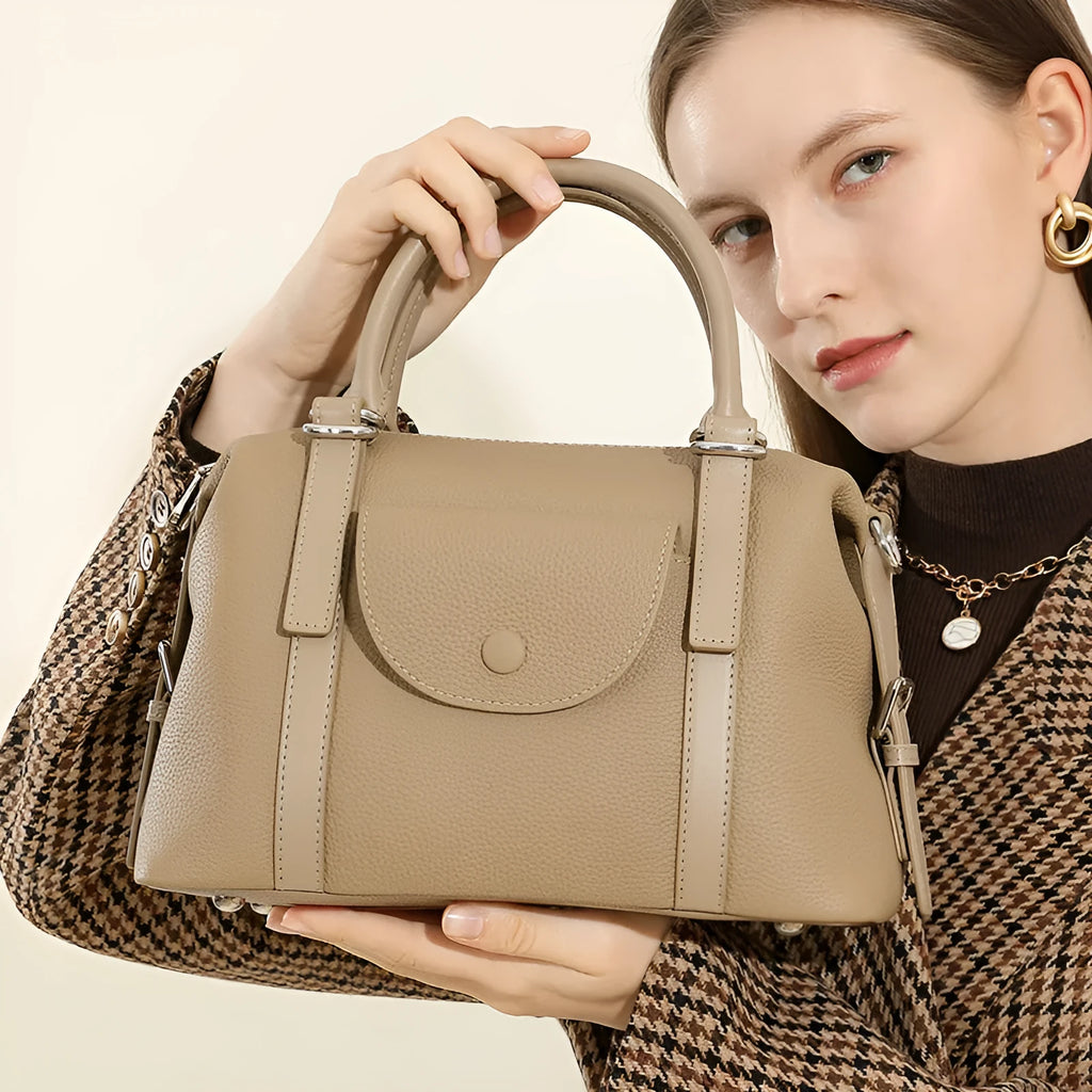 Genuine leather ladies handbag with contrast stitching and lock detail in street-trend style